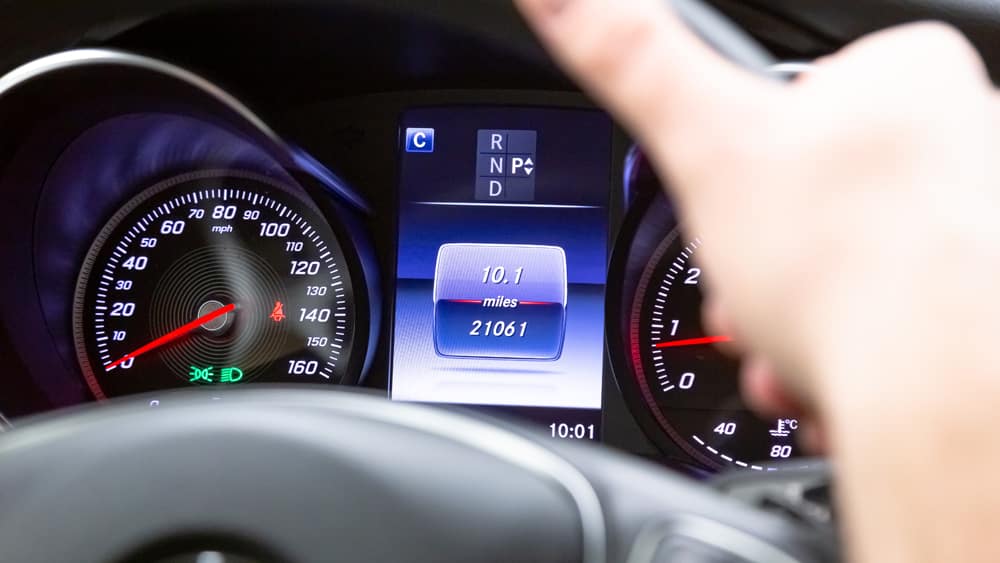 Press the up or down button until your screen shows the mileage of the car.